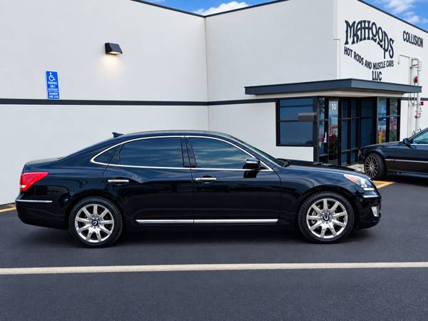 Black sedan outside the Mahood's building
