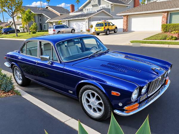 Dark blue Jaguar sedan with fresh paint
