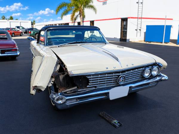 Cream classic Buick convertible with front fender damage