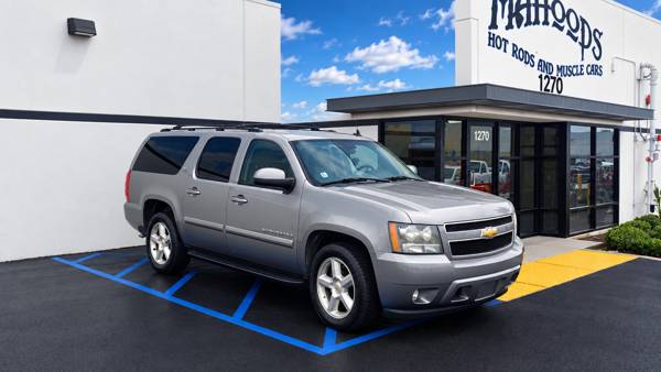 Gray Chevrolet Tahoe outside the shop