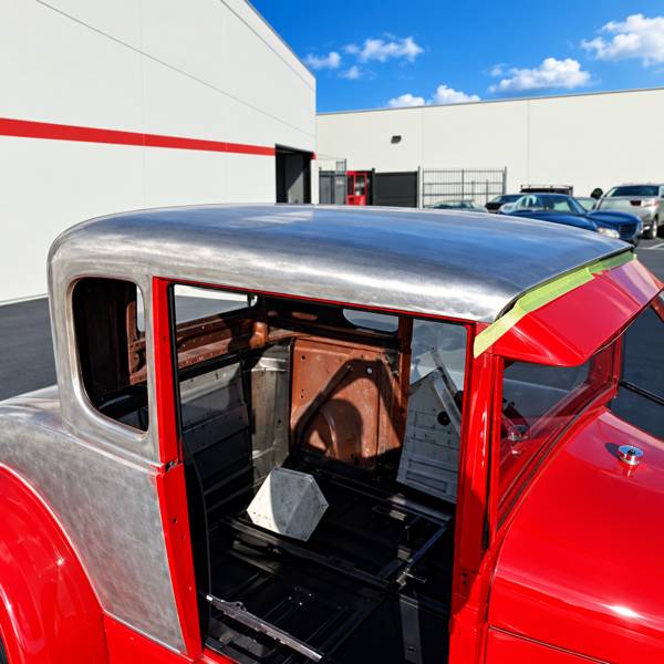 Hot rod body in bare metal and red