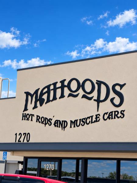 Mahood's Hot Rods and Muscle Cars sign on the building