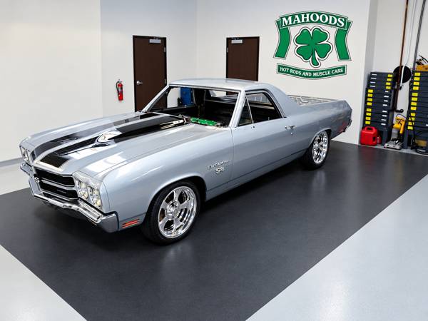 Silver El Camino with black stripes inside the shop